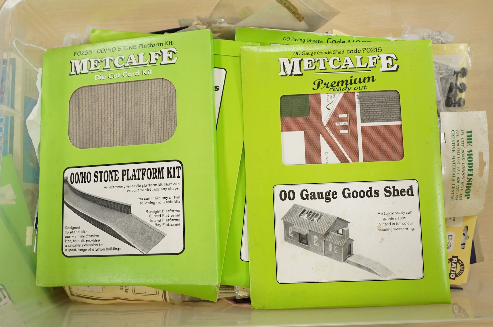 A collection of 00 gauge model railway, including three box train sets by Jouef, Mainline and Hornby, together with a large selection of unconstructed railway related plastic and metal kits and accessories, manufacturers